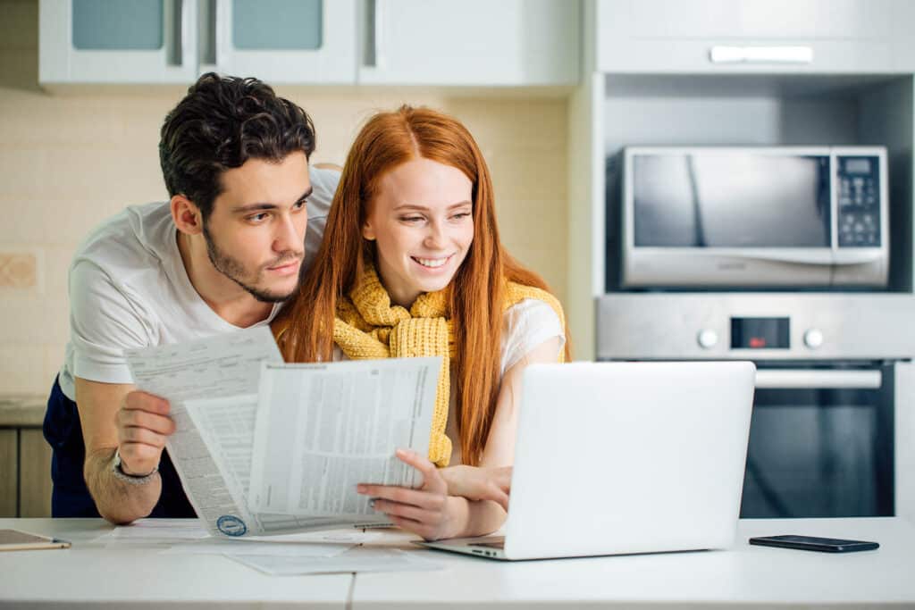Couple looking at laptop screen together